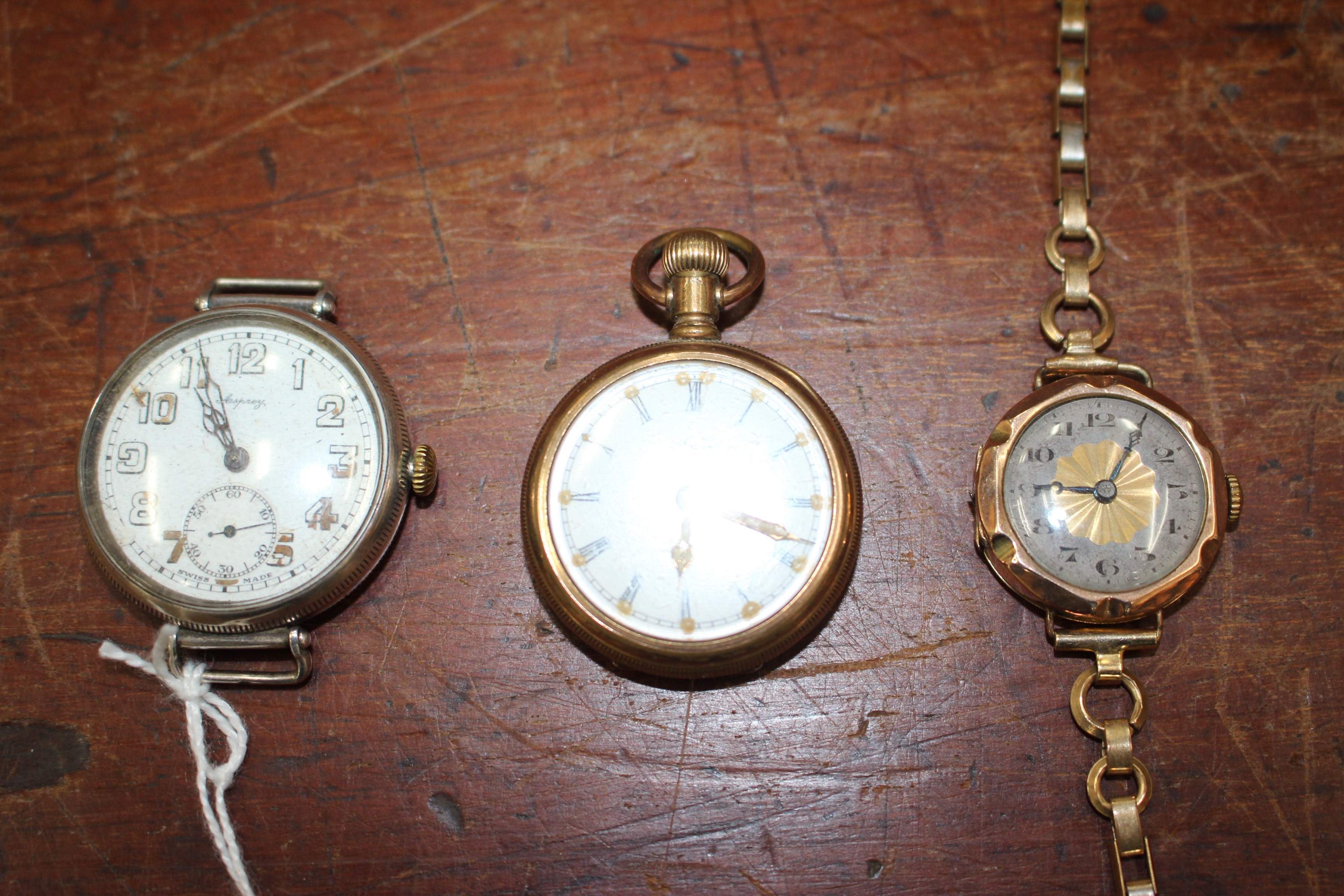 AN EARLY 20TH CENTURY ASPREY WHITE METAL, POSSIBLY SILVER, WRIST WATCH the enamelled dial with