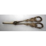 A PAIR OF VICTORIAN SILVER GRAPE SCISSORS with cherub mask and foliate decoration and marks for