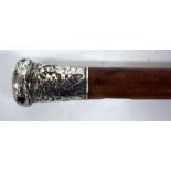 AN OLD MALACCA WALKING CANE with Oriental white metal embossed silver finial 91cm long