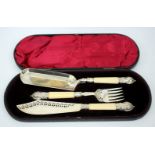 A VICTORIAN CASE SILVER MOUNTED IVORY HANDLED SERVING KNIFE AND FORK with pierced decoration