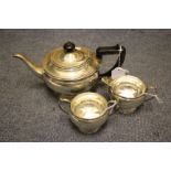 A 20TH CENTURY SILVER THREE PIECE TEASET the teapot engraved A & H.D. 1912 - 1939, with marks for