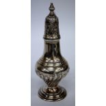 A 20TH CETNURY SILVER SUGAR CASTOR of baluster form with half gadrooned body, marks for Sheffield,