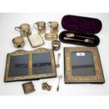 TWO SILVER MOUNTED PHOTOGRAPH FRAMES together with further silver items to include mustard pots a