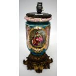 A CONTINENTAL PORCELAIN AND GILT METAL MOUNTED TABLE LAMP of moulded cylindrical form with a