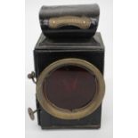 AN OLD BLACK PAINTED MILLER VEHICLE LAMP 17.5cm high