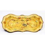 A PONTYPOOL JAPANNED WARE SNUFFER TRAY with shaped edge and decorated with nesting birds within a