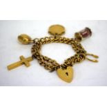 A 9-CARAT GOLD CHARM BRACELET together with a number of yellow metal charms and a 1903 sovereign