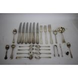 THREE SILVER OLD ENGLISH PATTERN TABLE FORKS together with a silver sauce label, six silver