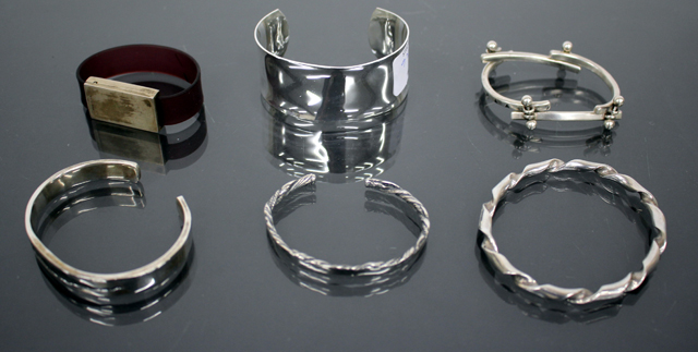 A SILVER BANGLE of twisted form together with a silver bracelet by Justice and further various