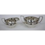 A MAPPIN AND WEBB LIMITED SILVER SUGAR BOWL with gadrooned rim and squared loop handles to either