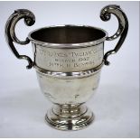 A SILVER TROPHY CUP with scrolling handle for the ladies 'Twelve' club winner, 1952, Mrs M.H. Benson