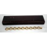 A LADIES 9 CARAT GOLD BRACELET with diamond shaped rusticated links, approximately 42 grams in