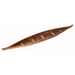 AN EARLY TO MID 20TH CENTURY OCEANIC CARVED WOODEN CANOE MODEL, 110cm long