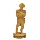 A 19TH CENTURY INDIAN CARVED IVORY SCULPTURE OF NAPOLEON standing with his arms crossed, 7.8cm