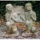 A PAIR OF 20TH CENTURY COMPOSITE STONE KNEELING FIGURE STATUES each approximately 73cm in height