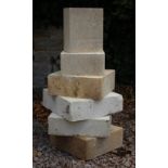 SIX VARIOUS CUT LIMESTONE BLOCKS, the largest approximately 41cm x 35cm x 10.5cm  (6)