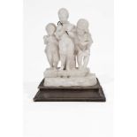 AN ALABASTER SCULPTURE OF THREE CHILDREN standing at the edge of a pavement 'The Rat Catchers',