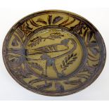 SETH CARDEW (b. 1934), a circular stoneware dish decorated with a bird with impressed potters mark