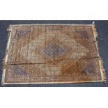 AN OLD EASTERN SILK BEIGE GROUND RUG with a radiating diamond motif all over floral geometric