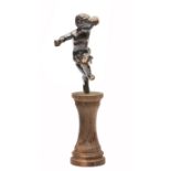 A SMALL FRENCH BRONZE CHERUB mounted on a turned wooden socle, 10cm in height