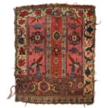 AN ANTIQUE BIDJAR RUG with vertical rows of stylised patterns on a rose red ground 100cm x 90cm