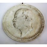 A 19TH CENTURY BISQUE PORCELAIN CIRCULAR PLAQUE 23cm diameter