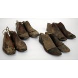 FOUR PAIRS OF CARVED WOODEN SHOE LASTS the largest approximately 27cm long