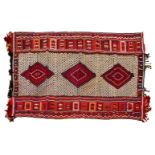 A FINE EASTERN ANATOLIAN BROCADED WOOL KELIM with three diamond medallions in an intricate lattice