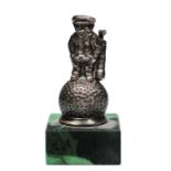 A DUNLOP 31 SILVER PLATED CAR MASCOT, golfer standing on top of a golf ball, 9cm tall overall