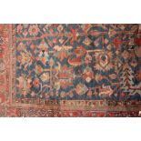 A LARGE SECTION OF A LATE 19TH CENTURY TURKISH BLUE, RED AND GREEN GROUND RUG with a banded border