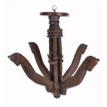 A GUJARATI CARVED WOODEN CLOTHES HANGER, a central cluster column support with four shaped arms each