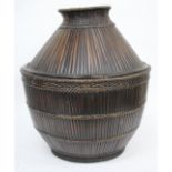 A PHILIPPINES LARGE STORAGE BASKET constructed from stripped bamboo, approximately 60cm tall