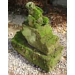 A CARVED STONE GROTESQUE, 32cm high together with two pieces of cut stone (3)