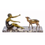 A 1930'S ART DECO PATINATED AND PAINTED SPELTER FIGURE of a girl with a fawn on variegated marble