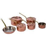 A SET OF HEAVY COPPER SAUCEPANS with cast brass handles consisting of a stock pot and cover 24cm