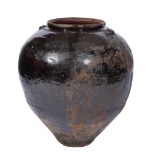 A LARGE MARTABAN BROWN GLAZED OVOID VASE with studded decoration to the rim, 67cm high