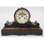 A LATE 19TH / EARLY 20TH CENTURY FRENCH RED MARBLE AND BLACK SLATE DRUM MANTLE CLOCK the movement