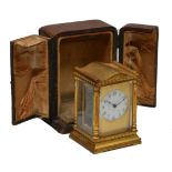 A MID 20TH CENTURY FRENCH MINIATURE CARRIAGE TIMEPIECE the gilt brass case undulating top and fluted