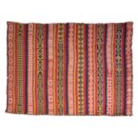 AN EARLY 20TH CENTURY AFGHAN RUST RED GROUND KELIM with banded decoration 178cm x 213cm