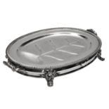 A VICTORIAN SILVER PLATED OVAL WARMING MEAT DISH with gadrooned edge, flower decorated handles and