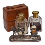 A SILVER PLATED SHEFFIELD MADE DESK STAND cast with a jockey seated on the back of a racehorse and