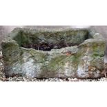 AN OLD RECTANGULAR STONE TROUGH, 90cm wide x 40cm high