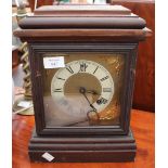 AN AMERICAN ANSONIA CLOCK COMPANY MANTLE CLOCK with dark stained case, brass dial and roman