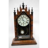 A 19TH CENTURY WALNUT MANTLE CLOCK with castellated top and white painted dial with black painted