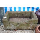 AN OLD RECTANGULAR STONE TROUGH, 90cm wide x 40cm high