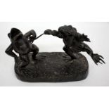 A BRONZED SCULPTURE OF TWO FROGS FIGHTING, 27cm wide x 18.5cm high