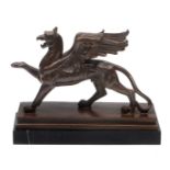 A BRONZE SCULPTURE OF A GRIFFIN mounted on a rectangular stone base, 29cm long