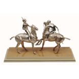 A SILVER SCULPTURE of two polo players on horseback by Theo Fennell, hallmarks for London 1994,