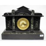 A LATE 19TH CENTURY BLACK SLATE AND MARBLE MANTLE CLOCK of classical portico form, the gilt bezel