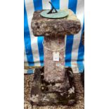 AN OLD STONE SUNDIAL with bronze dial and on square support and stepped base, 41cm diameter x 82cm